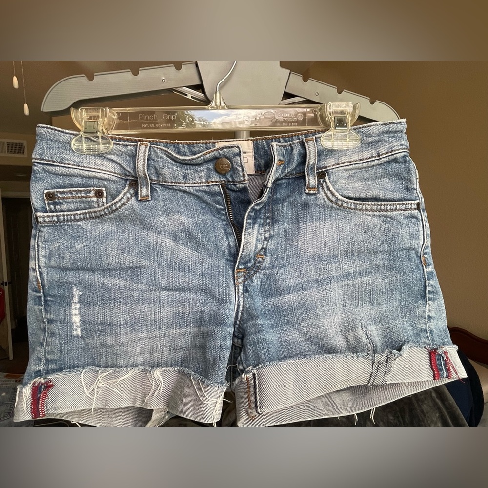 Label of graded goods denim jeans, light wash, size 27